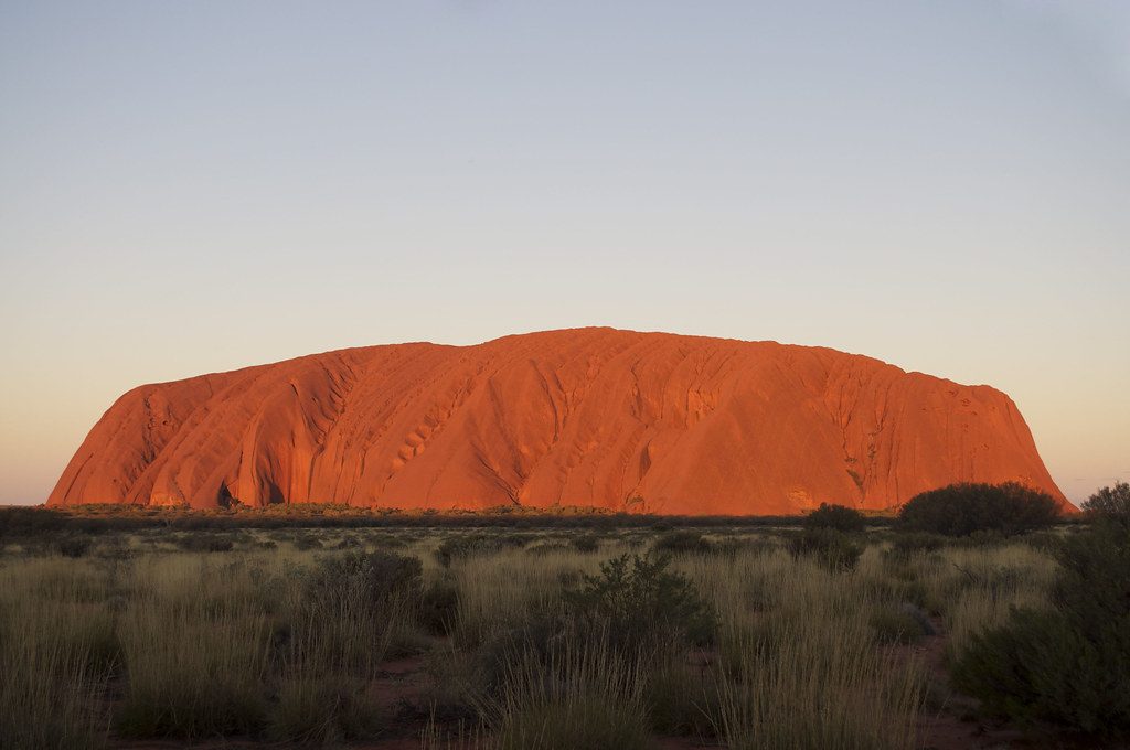 Uluru, red rock in the Australian desert, at sunset